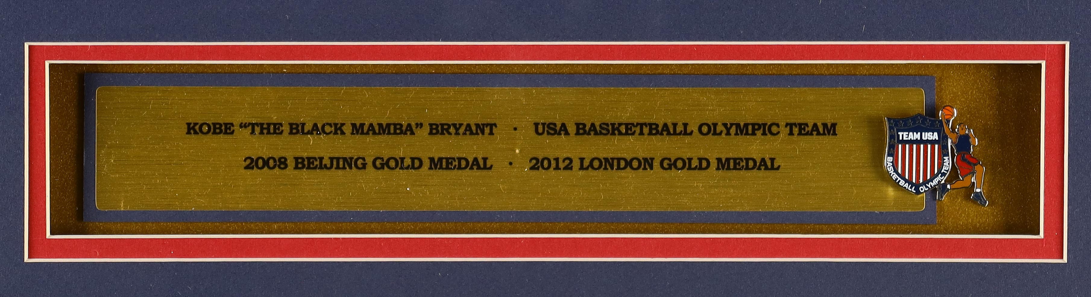 Kobe Bryant Custom Framed Jersey Display with Official Team USA Basketball Pin & (2) Cloth Logo Patches at PristineAuction.com Kobe Bryant Custom Framed Jersey Display with Official Team USA Basketball Pin & (2) Cloth Logo Patches at PristineAuction.com