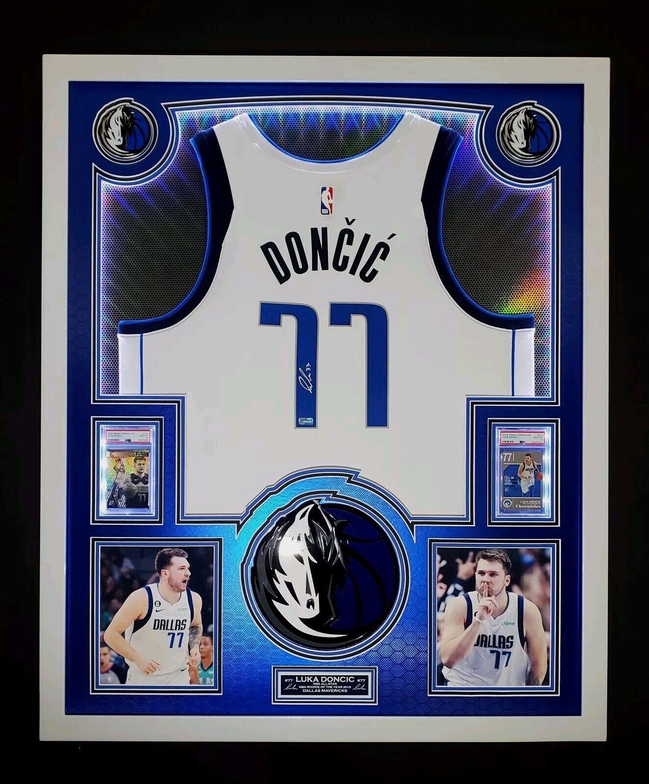 Luka Doncic Signed Mavericks Custom Framed LED Backlit Nike Jersey Display & (2) PSA 10 Graded Rookie Cards (Panini) at PristineAuction.com Luka Doncic Signed Mavericks Custom Framed LED Backlit Nike Jersey Display & (2) PSA 10 Graded Rookie Cards (Panini) at PristineAuction.com