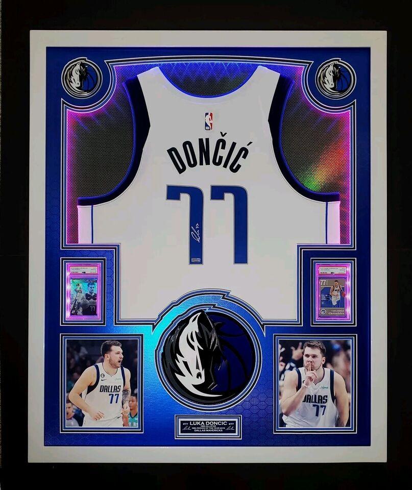 Luka Doncic Signed Mavericks Custom Framed LED Backlit Nike Jersey Display & (2) PSA 10 Graded Rookie Cards (Panini) at PristineAuction.com Luka Doncic Signed Mavericks Custom Framed LED Backlit Nike Jersey Display & (2) PSA 10 Graded Rookie Cards (Panini) at PristineAuction.com