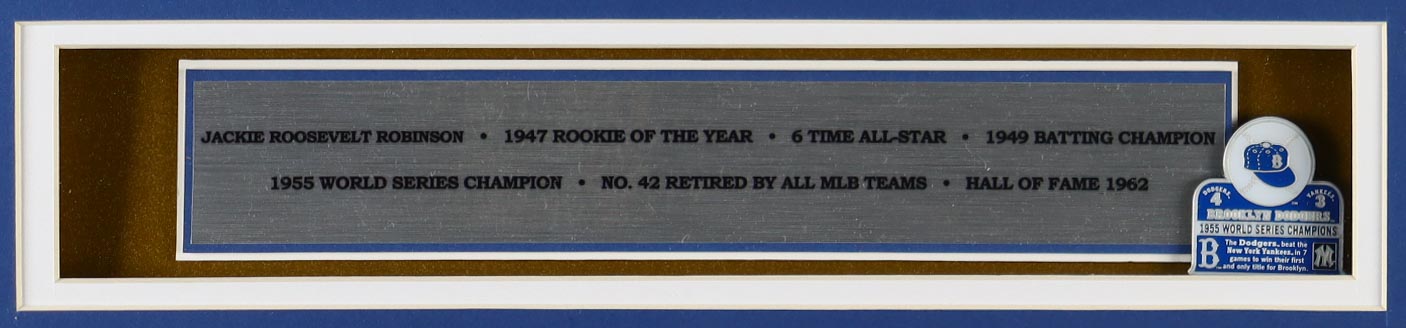 Jackie Robinson Custom Framed Jersey Display with 1955 World Championship Pin & (2) Logo Patches at PristineAuction.com Jackie Robinson Custom Framed Jersey Display with 1955 World Championship Pin & (2) Logo Patches at PristineAuction.com