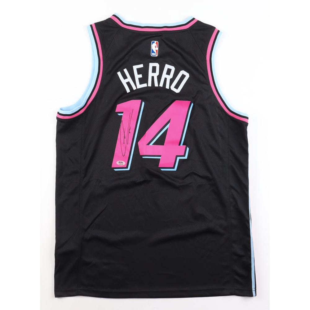 pink and turquoise nike shirt