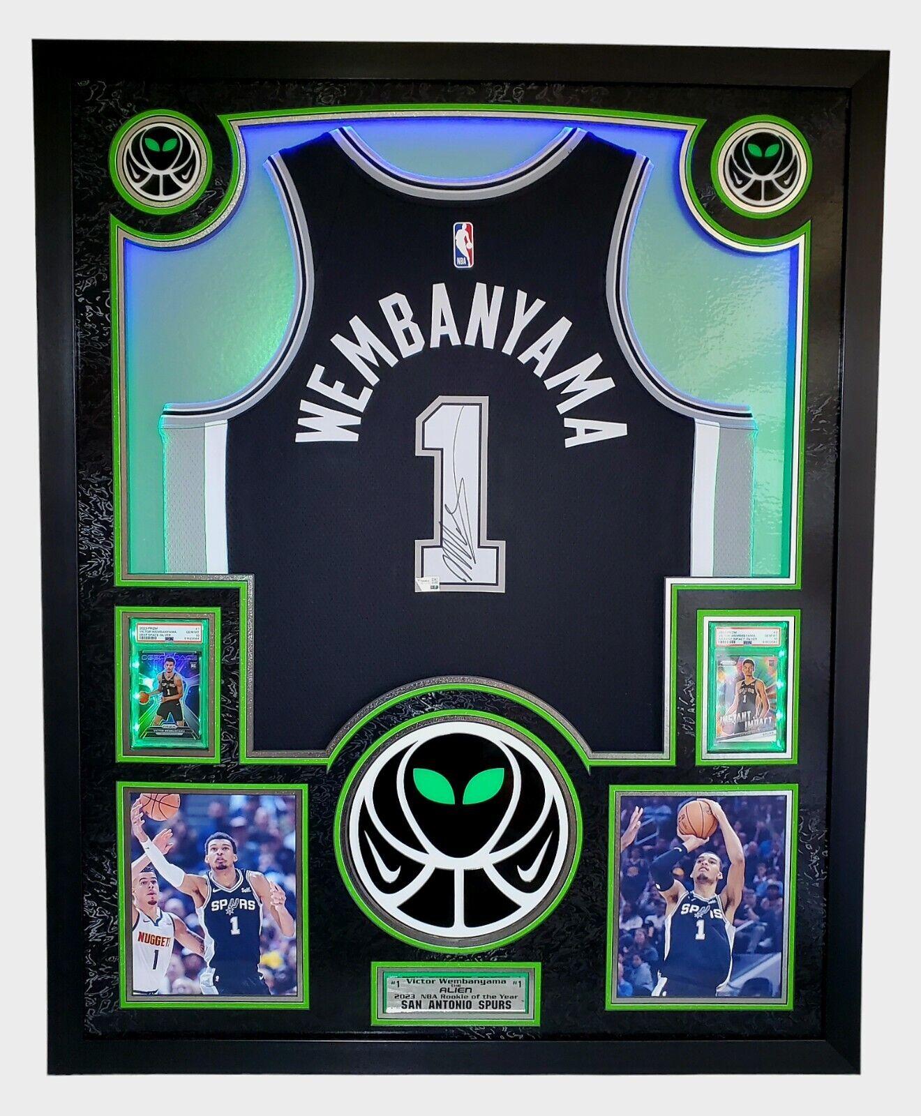 Victor Wembanyama Signed Spurs Custom Framed Nike Jersey with LED Display & (2) PSA 10 Graded Rookie Cards (Fanatics) at PristineAuction.com Victor Wembanyama Signed Spurs Custom Framed Nike Jersey with LED Display & (2) PSA 10 Graded Rookie Cards (Fanatics) at PristineAuction.com