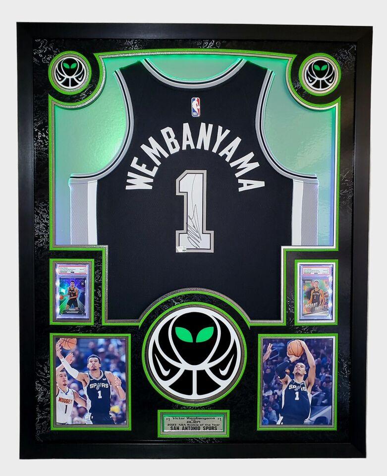 Victor Wembanyama Signed Spurs Custom Framed Nike Jersey with LED Display & (2) PSA 10 Graded Rookie Cards (Fanatics) at PristineAuction.com Victor Wembanyama Signed Spurs Custom Framed Nike Jersey with LED Display & (2) PSA 10 Graded Rookie Cards (Fanatics) at PristineAuction.com