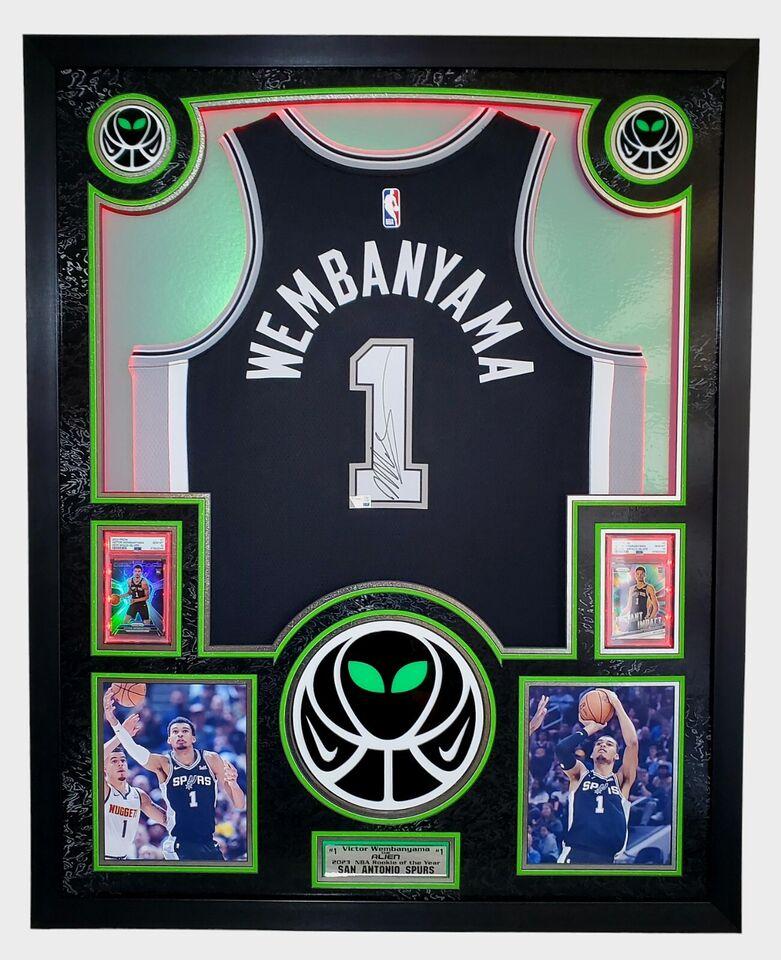 Victor Wembanyama Signed Spurs Custom Framed Nike Jersey with LED Display & (2) PSA 10 Graded Rookie Cards (Fanatics) at PristineAuction.com Victor Wembanyama Signed Spurs Custom Framed Nike Jersey with LED Display & (2) PSA 10 Graded Rookie Cards (Fanatics) at PristineAuction.com