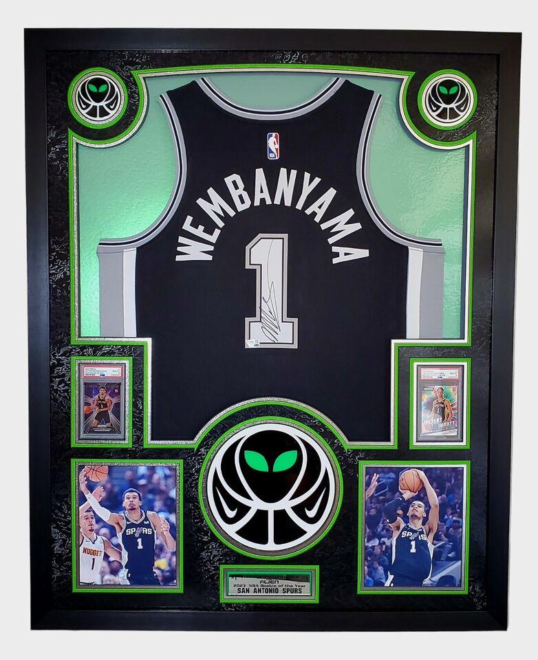 Victor Wembanyama Signed Spurs Custom Framed Nike Jersey with LED Display & (2) PSA 10 Graded Rookie Cards (Fanatics) at PristineAuction.com Victor Wembanyama Signed Spurs Custom Framed Nike Jersey with LED Display & (2) PSA 10 Graded Rookie Cards (Fanatics) at PristineAuction.com
