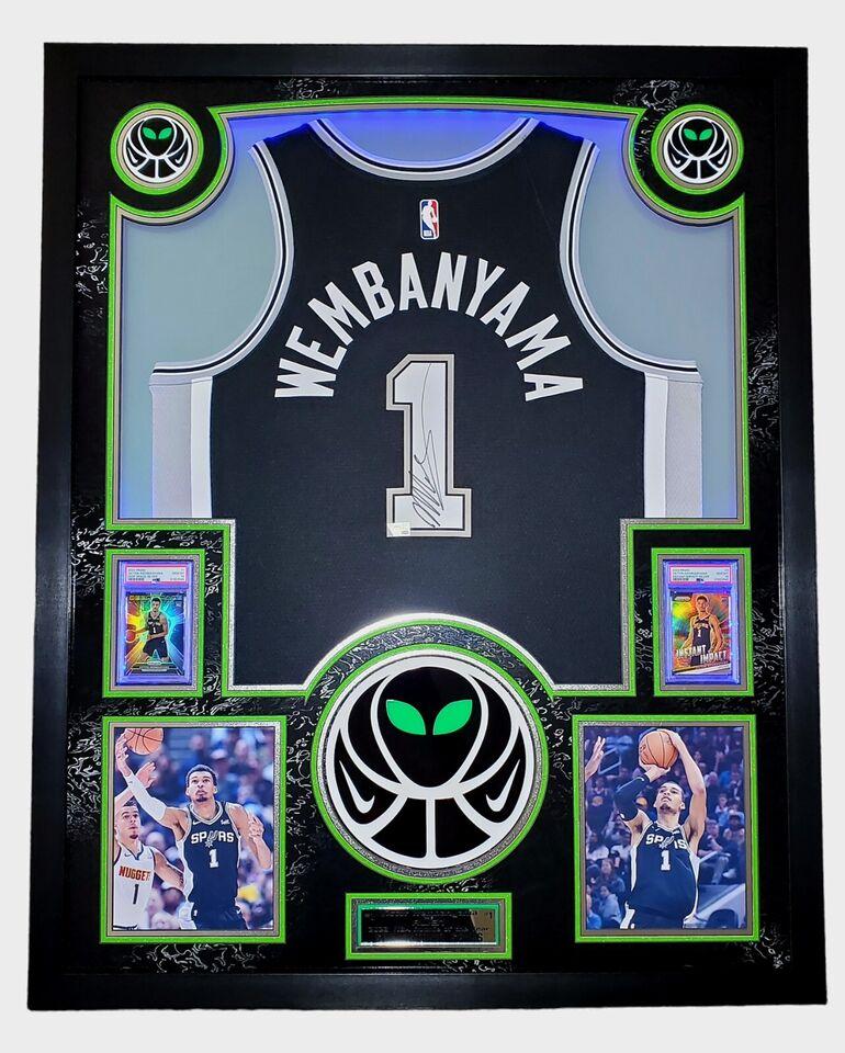 Victor Wembanyama Signed Spurs Custom Framed Nike Jersey with LED Display & (2) PSA 10 Graded Rookie Cards (Fanatics) at PristineAuction.com Victor Wembanyama Signed Spurs Custom Framed Nike Jersey with LED Display & (2) PSA 10 Graded Rookie Cards (Fanatics) at PristineAuction.com