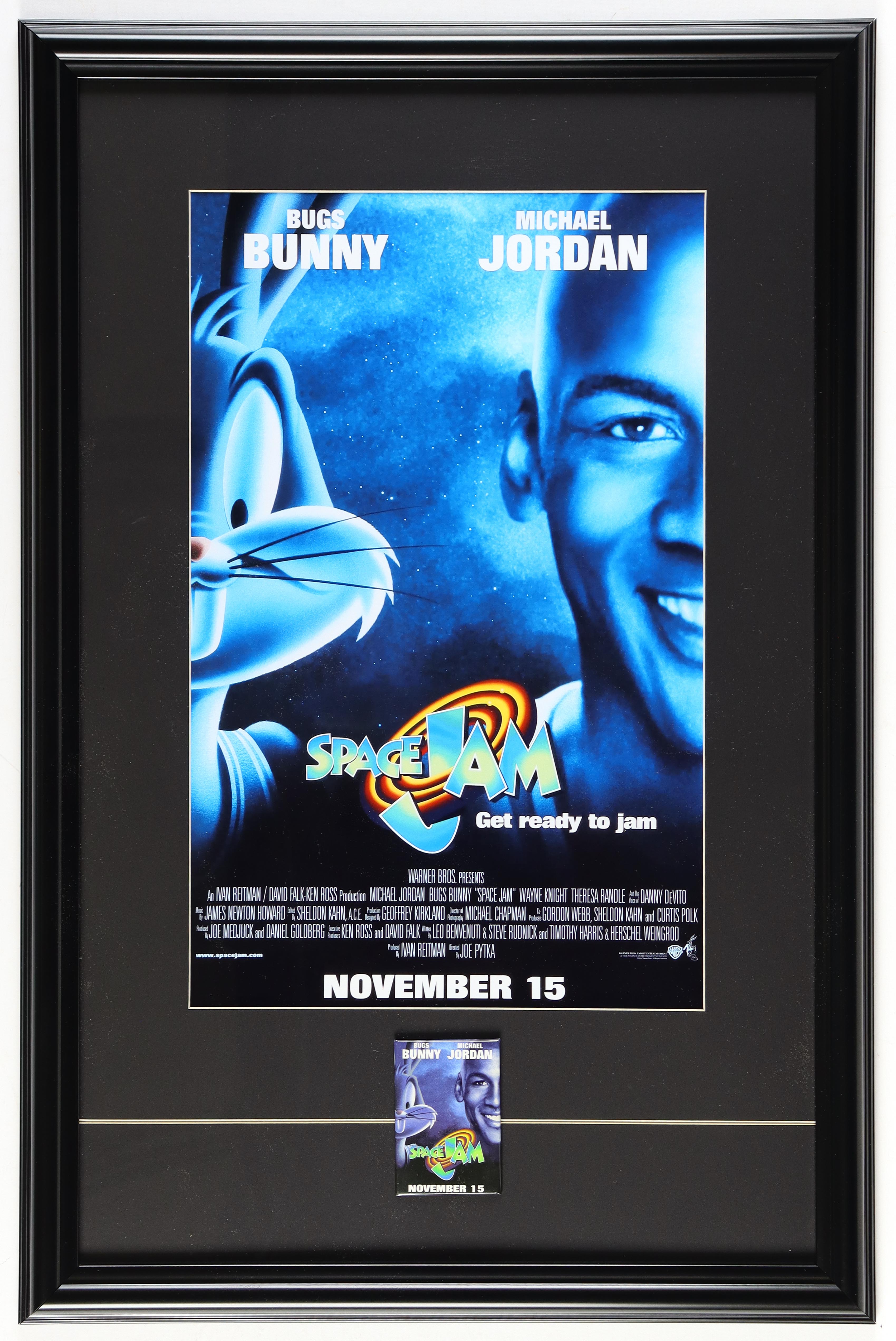 Michael Jordan "Space Jam" Custom Framed Movie Poster Display With Movie Release Pin at PristineAuction.com Michael Jordan "Space Jam" Custom Framed Movie Poster Display With Movie Release Pin at PristineAuction.com