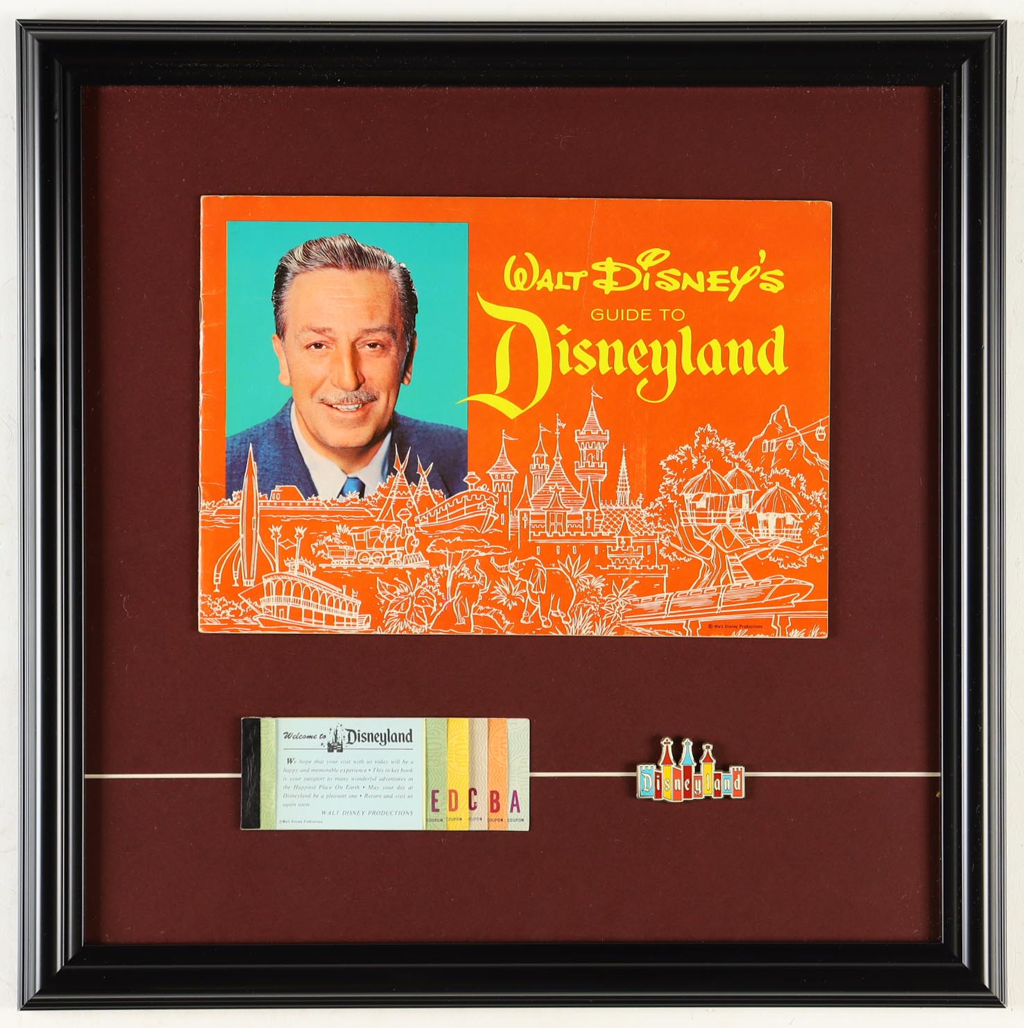 "Walt Disney's Guide to Disneyland" Custom Framed 1963 On-Site Guide Booklet with Vintage Souvenir Ticket Book & Vintage "It's A Small World" Park Logo Pin at PristineAuction.com "Walt Disney's Guide to Disneyland" Custom Framed 1963 On-Site Guide Booklet with Vintage Souvenir Ticket Book & Vintage "It's A Small World" Park Logo Pin at PristineAuction.com