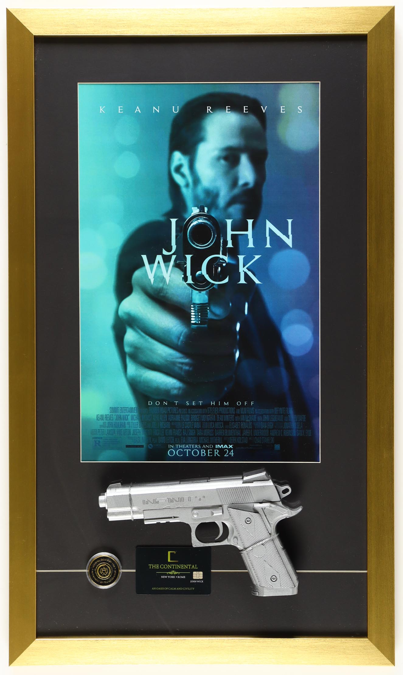 "John Wick" Custom Framed Movie Poster Display with Prop Replica Toy Pistol, Adjudicator Coin & Continental Replica Hotel Key Card at PristineAuction.com "John Wick" Custom Framed Movie Poster Display with Prop Replica Toy Pistol, Adjudicator Coin & Continental Replica Hotel Key Card at PristineAuction.com