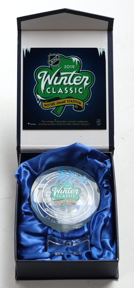 Patrice Bergeron Signed 2019 Winter Classic Logo Glass Hockey Puck with Game-Used Ice Water (YSMS) at PristineAuction.com Patrice Bergeron Signed 2019 Winter Classic Logo Glass Hockey Puck with Game-Used Ice Water (YSMS) at PristineAuction.com