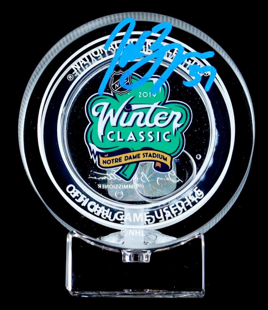 Patrice Bergeron Signed 2019 Winter Classic Logo Glass Hockey Puck with Game-Used Ice Water (YSMS) at PristineAuction.com Patrice Bergeron Signed 2019 Winter Classic Logo Glass Hockey Puck with Game-Used Ice Water (YSMS) at PristineAuction.com