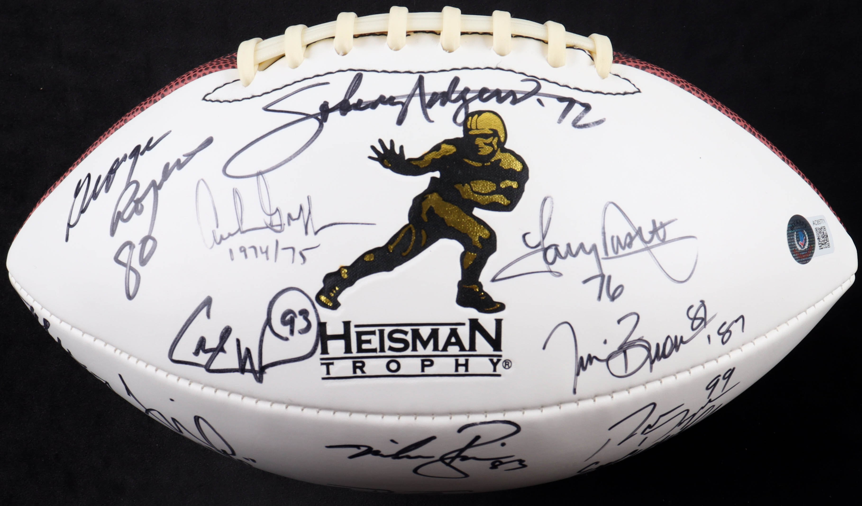 Heisman Trophy Winners Commemorative Football Signed by (20) with Johnny Rodgers, George Rogers, Tony Dorsett, Tim Brown with Trophy Year Inscriptions (Beckett) at PristineAuction.com Heisman Trophy Winners Commemorative Football Signed by (20) with Johnny Rodgers, George Rogers, Tony Dorsett, Tim Brown with Trophy Year Inscriptions (Beckett) at PristineAuction.com