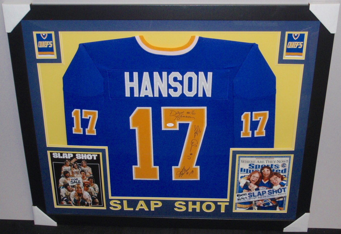 Hanson Brothers Signed "Slap Shot" Chiefs 35x43 Custom Framed Jersey Signed by (3) with Dave Hanson, Steve Carlson & Jeff Carlson (JSA COA) at PristineAuction.com Hanson Brothers Signed "Slap Shot" Chiefs 35x43 Custom Framed Jersey Signed by (3) with Dave Hanson, Steve Carlson & Jeff Carlson (JSA COA) at PristineAuction.com