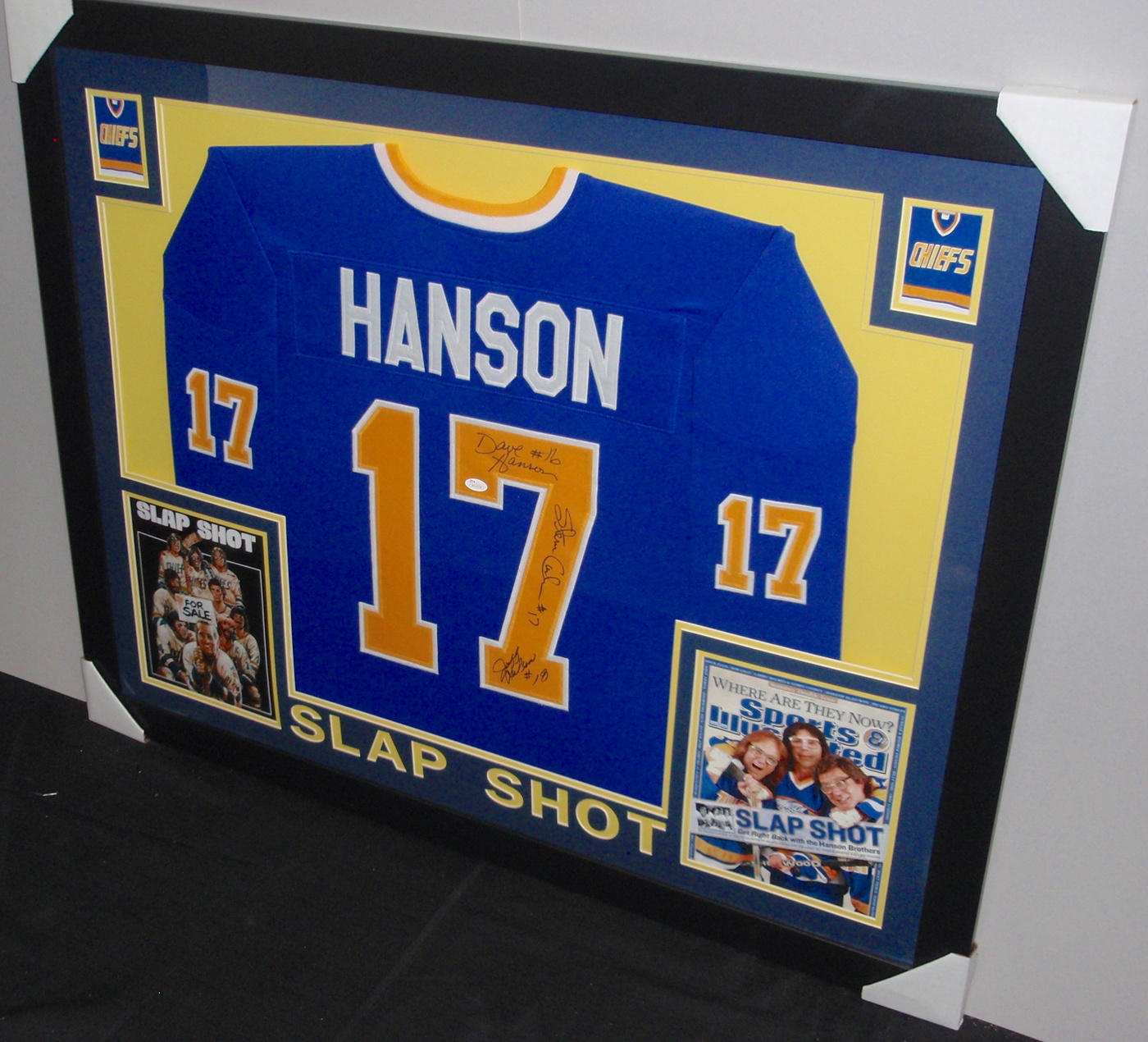 Hanson Brothers Signed "Slap Shot" Chiefs 35x43 Custom Framed Jersey Signed by (3) with Dave Hanson, Steve Carlson & Jeff Carlson (JSA COA) at PristineAuction.com Hanson Brothers Signed "Slap Shot" Chiefs 35x43 Custom Framed Jersey Signed by (3) with Dave Hanson, Steve Carlson & Jeff Carlson (JSA COA) at PristineAuction.com