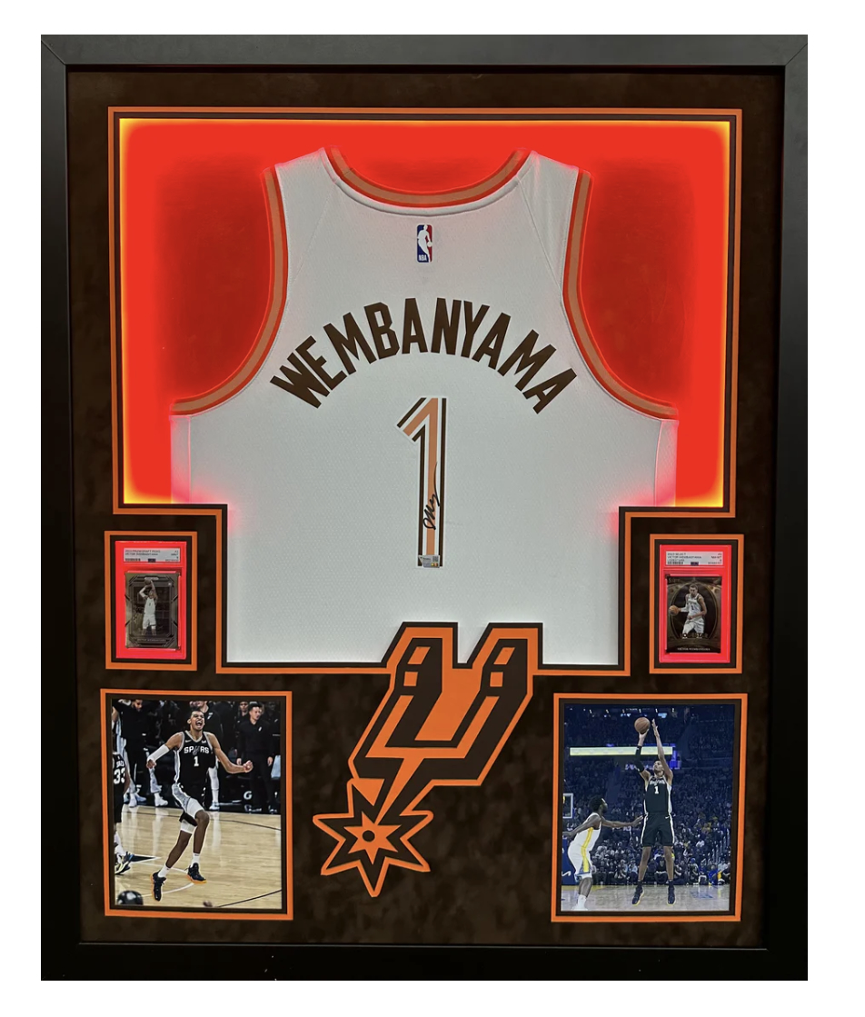 Victor Wembanyama Signed & Framed Spurs LED Backlit Jersey Display with PSA Trading Cards (Fanatics) at PristineAuction.com Victor Wembanyama Signed & Framed Spurs LED Backlit Jersey Display with PSA Trading Cards (Fanatics) at PristineAuction.com
