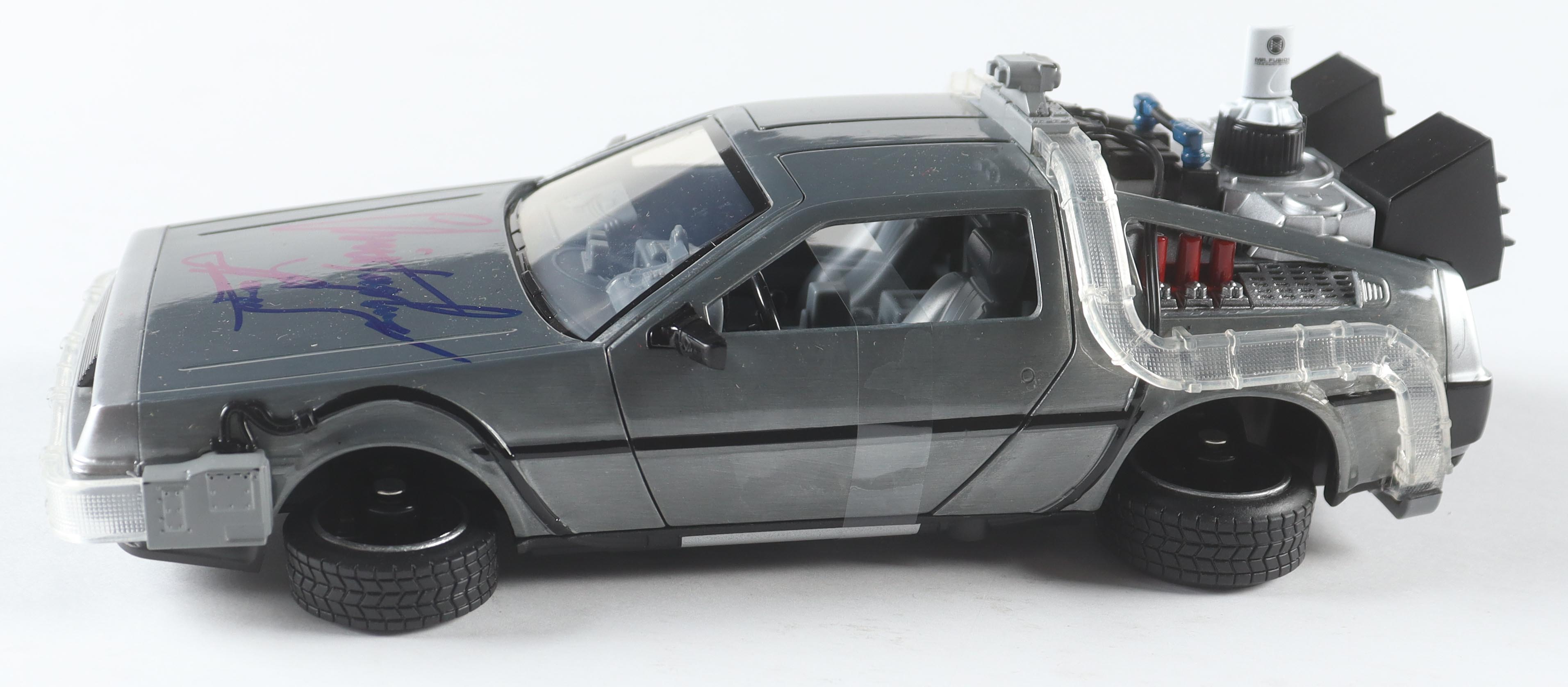 Christopher Lloyd Signed "Back to the Future Part 2" DeLorean Time Machine 1:24 Scale Die-Cast Car (Beckett) at PristineAuction.com Christopher Lloyd Signed "Back to the Future Part 2" DeLorean Time Machine 1:24 Scale Die-Cast Car (Beckett) at PristineAuction.com