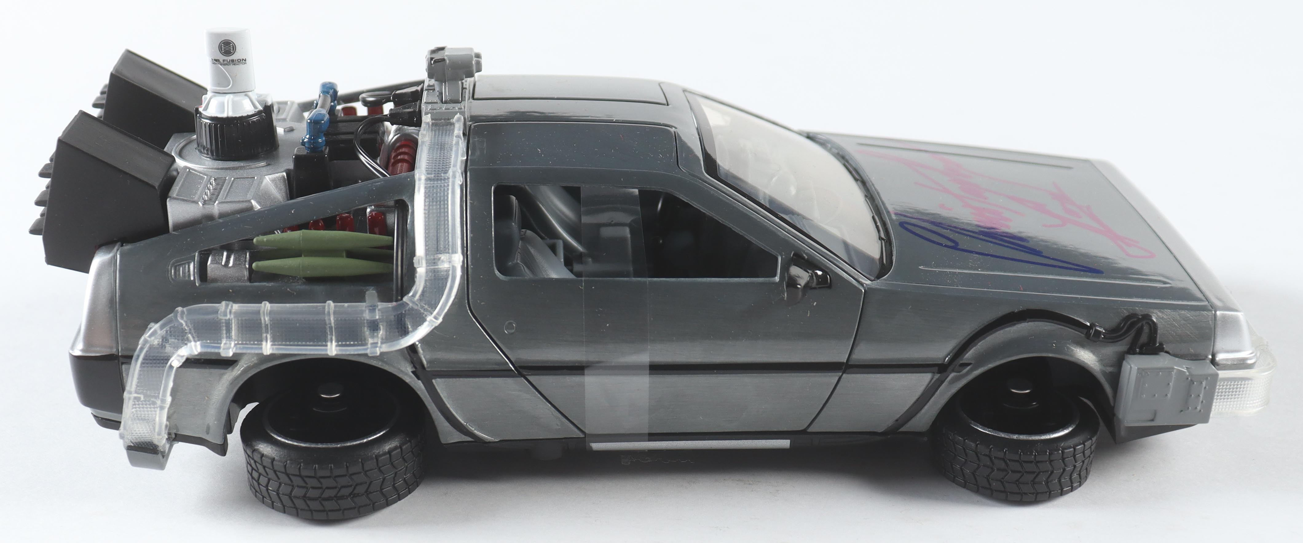 Christopher Lloyd Signed "Back to the Future Part 2" DeLorean Time Machine 1:24 Scale Die-Cast Car (Beckett) at PristineAuction.com Christopher Lloyd Signed "Back to the Future Part 2" DeLorean Time Machine 1:24 Scale Die-Cast Car (Beckett) at PristineAuction.com