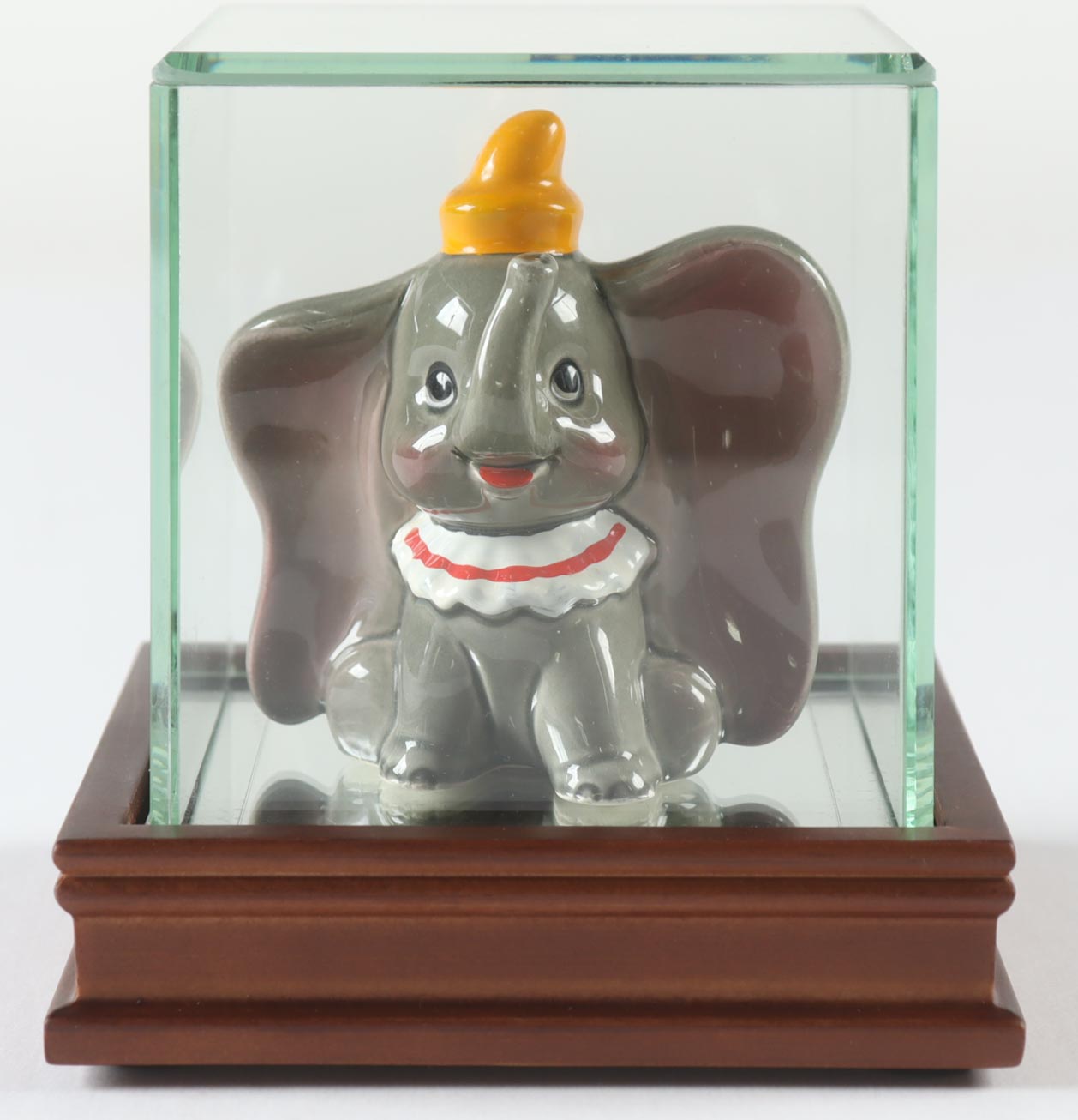1965 Vintage Dumbo Disney 3.5"Ceramic Figure with Display Case at PristineAuction.com 1965 Vintage Dumbo Disney 3.5"Ceramic Figure with Display Case at PristineAuction.com
