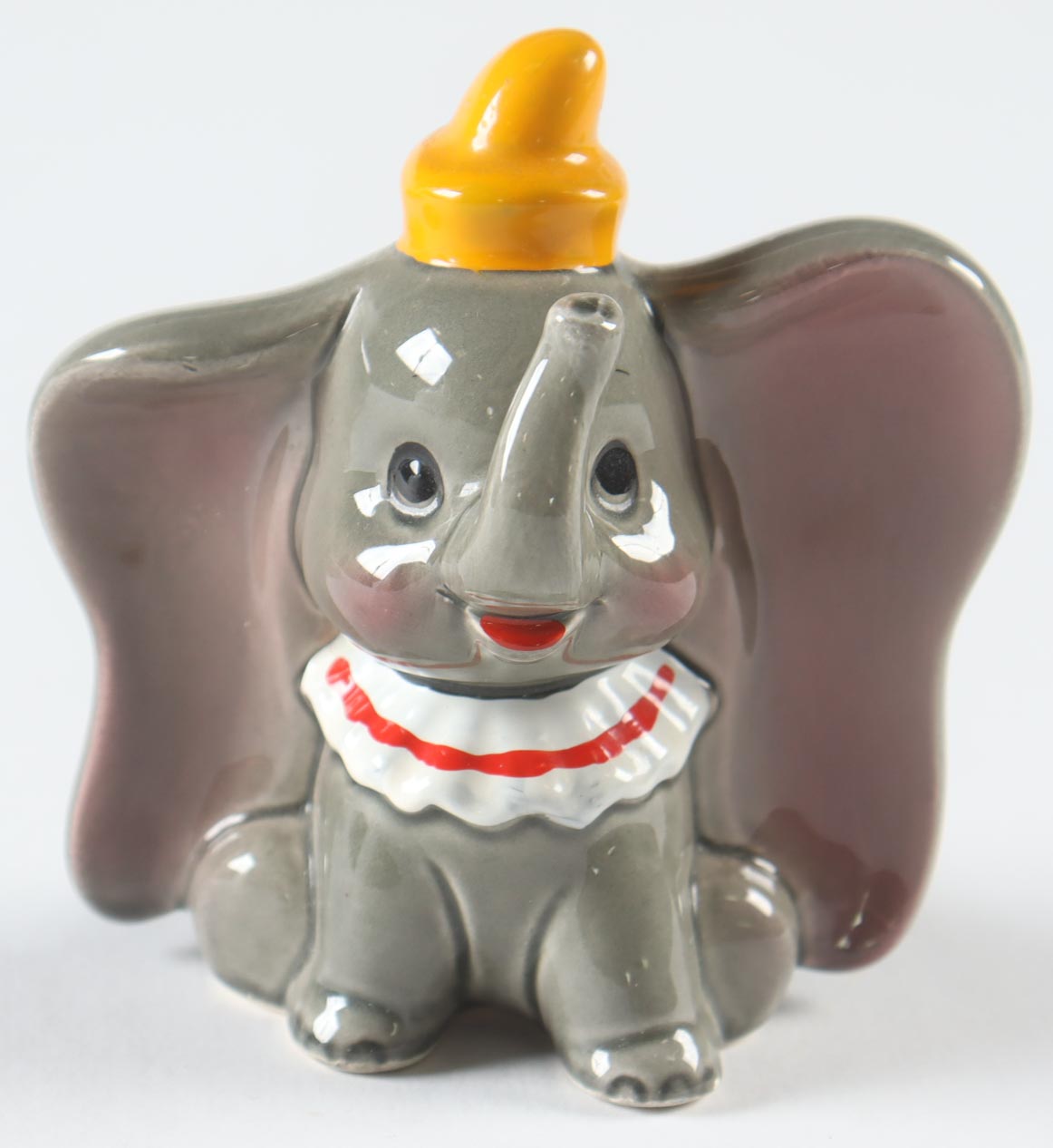 1965 Vintage Dumbo Disney 3.5"Ceramic Figure with Display Case at PristineAuction.com 1965 Vintage Dumbo Disney 3.5"Ceramic Figure with Display Case at PristineAuction.com