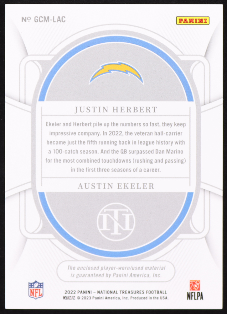Justin Herbert / Austin Ekeler 2022 Panini National Treasures NFL Gear Combo Materials #GCMLAC #83/99 at PristineAuction.com Justin Herbert / Austin Ekeler 2022 Panini National Treasures NFL Gear Combo Materials #GCMLAC #83/99 at PristineAuction.com