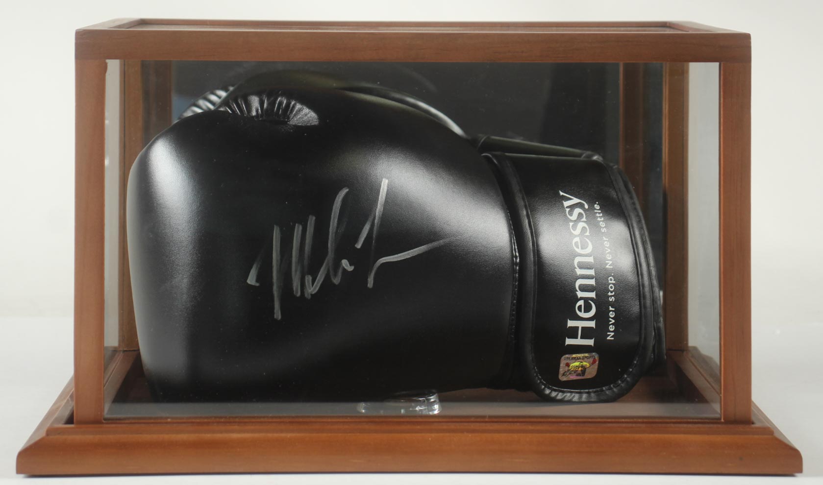 Mike Tyson Signed Hennessy Fight Sponsor Only Black Boxing Glove In Display Case (Tyson) at PristineAuction.com Mike Tyson Signed Hennessy Fight Sponsor Only Black Boxing Glove In Display Case (Tyson) at PristineAuction.com