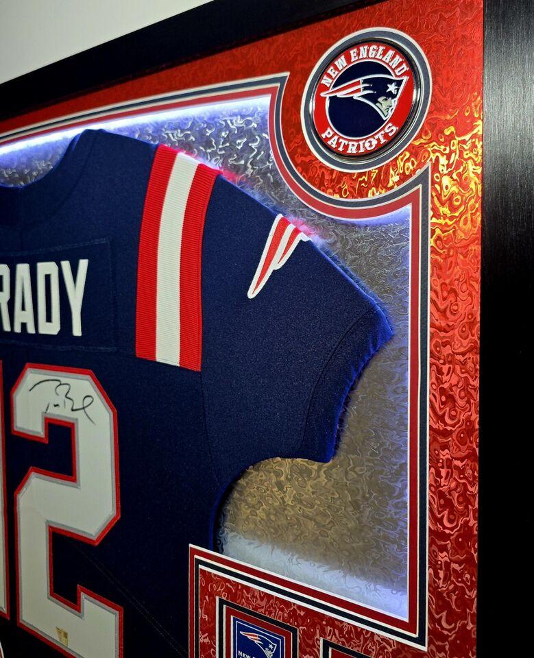 Tom Brady Signed LE Patriots Custom Framed LED Backlit Nike Elite Jersey Display with (6) Replica Super Bowl Banners (Fanatics) at PristineAuction.com Tom Brady Signed LE Patriots Custom Framed LED Backlit Nike Elite Jersey Display with (6) Replica Super Bowl Banners (Fanatics) at PristineAuction.com