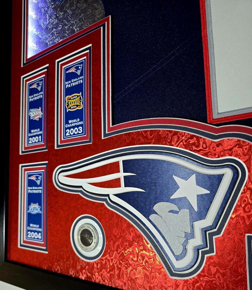 Tom Brady Signed LE Patriots Custom Framed LED Backlit Nike Elite Jersey Display with (6) Replica Super Bowl Banners (Fanatics) at PristineAuction.com Tom Brady Signed LE Patriots Custom Framed LED Backlit Nike Elite Jersey Display with (6) Replica Super Bowl Banners (Fanatics) at PristineAuction.com