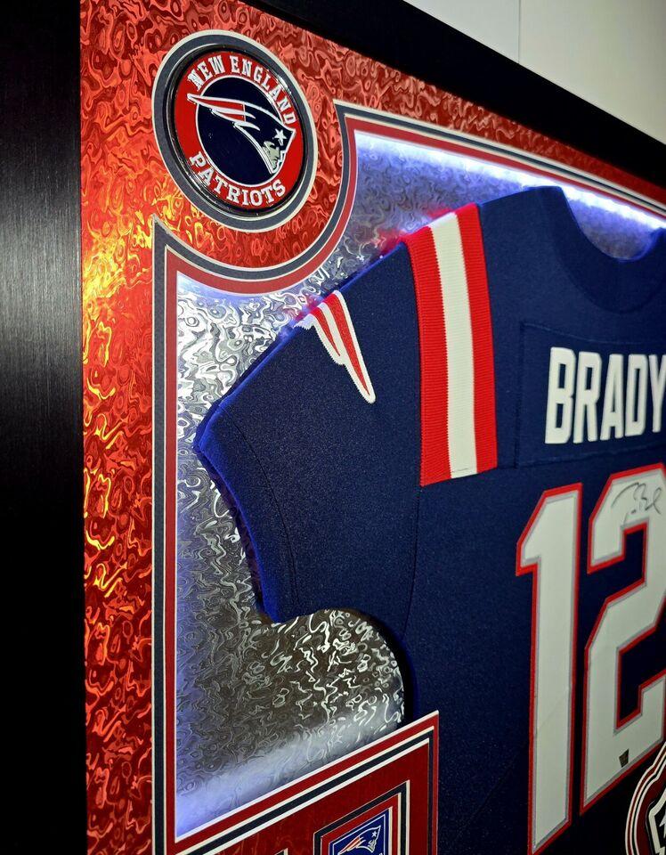 Tom Brady Signed LE Patriots Custom Framed LED Backlit Nike Elite Jersey Display with (6) Replica Super Bowl Banners (Fanatics) at PristineAuction.com Tom Brady Signed LE Patriots Custom Framed LED Backlit Nike Elite Jersey Display with (6) Replica Super Bowl Banners (Fanatics) at PristineAuction.com