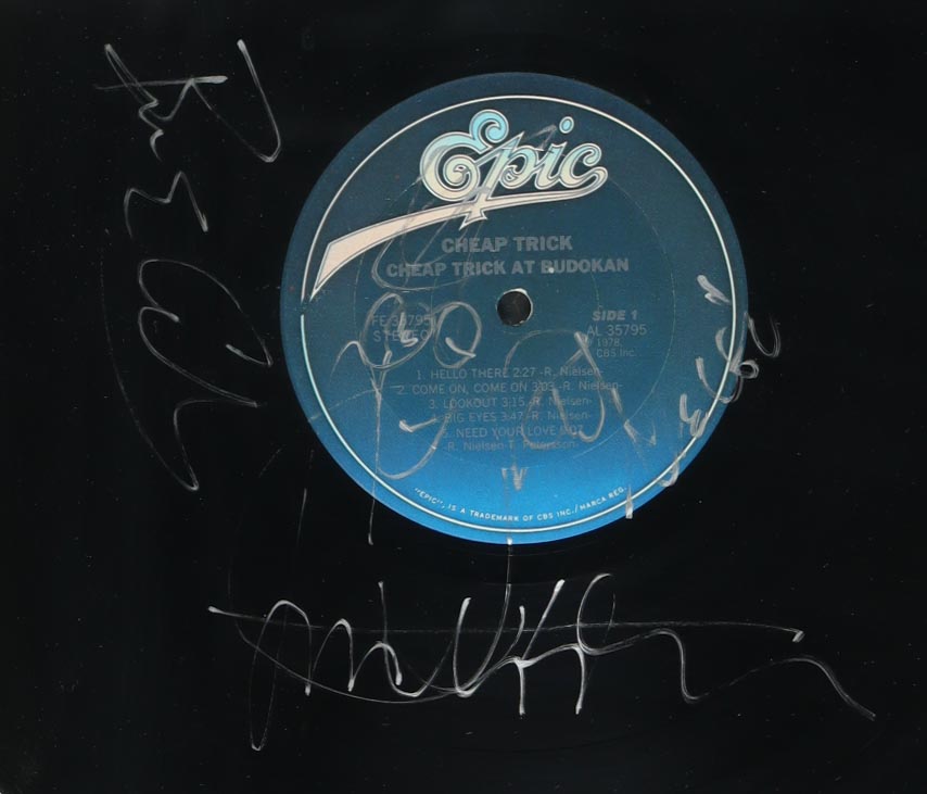 Cheap Trick "Cheap Trick at Budokan" Custom Framed Vinyl Album Cover Band-Signed By (4) with Bun E. Carlos, Rick Nielsen, Tom Petersson (JSA) at PristineAuction.com Cheap Trick "Cheap Trick at Budokan" Custom Framed Vinyl Album Cover Band-Signed By (4) with Bun E. Carlos, Rick Nielsen, Tom Petersson (JSA) at PristineAuction.com