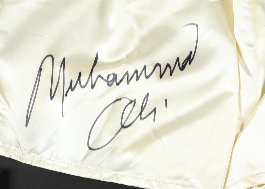 Muhammad Ali Signed 33.5x41.5 Custom Framed Boxing Trunks and Photo Display (Beckett) at PristineAuction.com Muhammad Ali Signed 33.5x41.5 Custom Framed Boxing Trunks and Photo Display (Beckett) at PristineAuction.com
