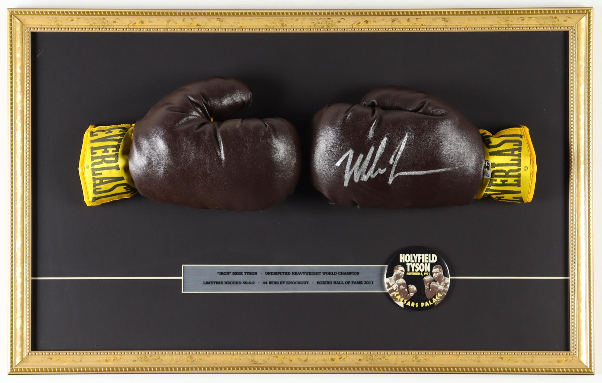 Mike Tyson Signed Custom Framed Everlast Boxing Glove Set Display with Official 1991 Caesar's Palace "Holyfield vs Tyson" Pin (Tyson) at PristineAuction.com Mike Tyson Signed Custom Framed Everlast Boxing Glove Set Display with Official 1991 Caesar's Palace "Holyfield vs Tyson" Pin (Tyson) at PristineAuction.com