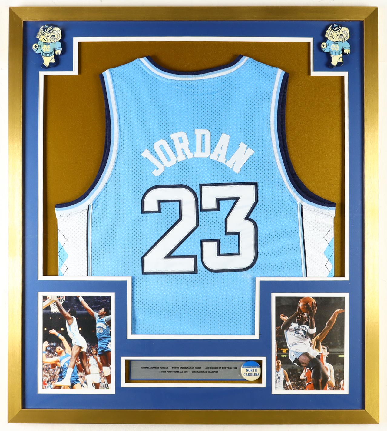 Michael Jordan Custom Framed Jersey Display With Vintage Tar Heels Pin & (2) Vintage Team Logo Ceramic Badges at PristineAuction.com Michael Jordan Custom Framed Jersey Display With Vintage Tar Heels Pin & (2) Vintage Team Logo Ceramic Badges at PristineAuction.com