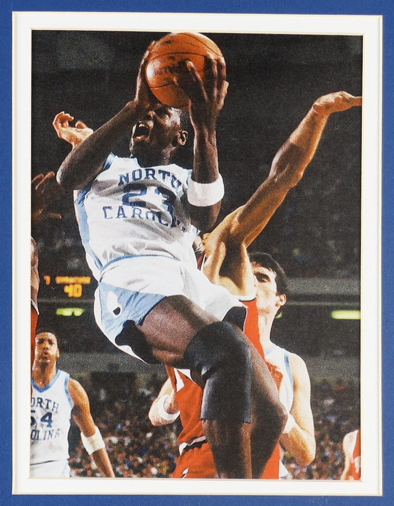 Michael Jordan Custom Framed Jersey Display With Vintage Tar Heels Pin & (2) Vintage Team Logo Ceramic Badges at PristineAuction.com Michael Jordan Custom Framed Jersey Display With Vintage Tar Heels Pin & (2) Vintage Team Logo Ceramic Badges at PristineAuction.com