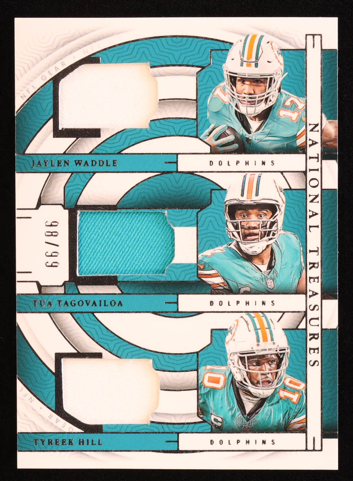 Jaylen Waddle / Tua Tagovailoa / Tyreek Hill 2023 Panini National Treasures NFL Gear Trio Materials #8 #98/99 at PristineAuction.com Jaylen Waddle / Tua Tagovailoa / Tyreek Hill 2023 Panini National Treasures NFL Gear Trio Materials #8 #98/99 at PristineAuction.com