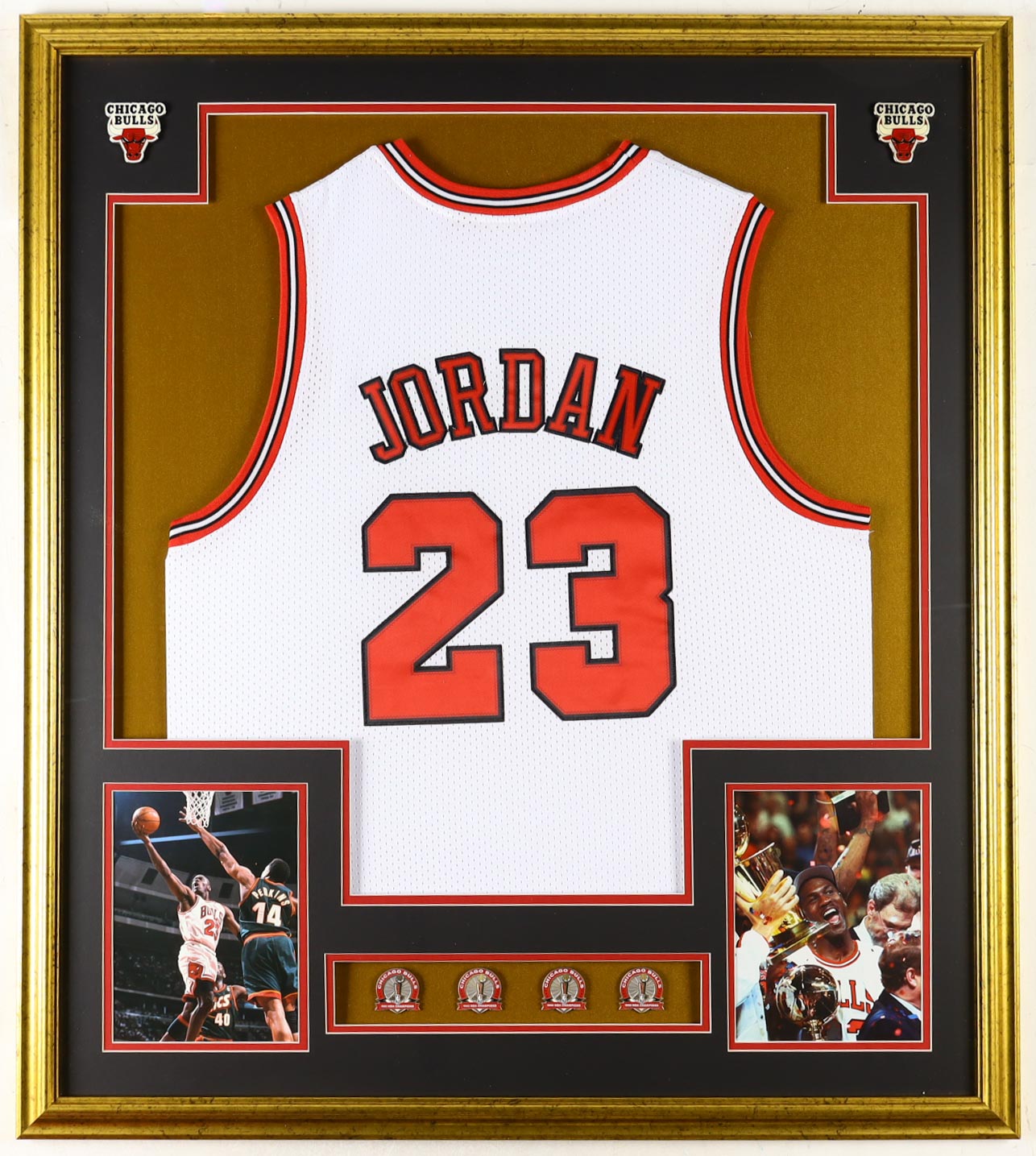 Michael Jordan Custom Framed Jersey Display with (4) LE Championship Pins & (2) Metal Team Logo Emblems at PristineAuction.com Michael Jordan Custom Framed Jersey Display with (4) LE Championship Pins & (2) Metal Team Logo Emblems at PristineAuction.com