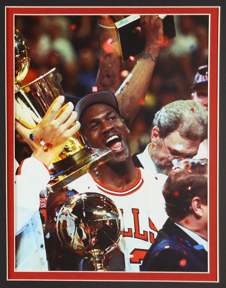 Michael Jordan Custom Framed Jersey Display with (4) LE Championship Pins & (2) Metal Team Logo Emblems at PristineAuction.com Michael Jordan Custom Framed Jersey Display with (4) LE Championship Pins & (2) Metal Team Logo Emblems at PristineAuction.com