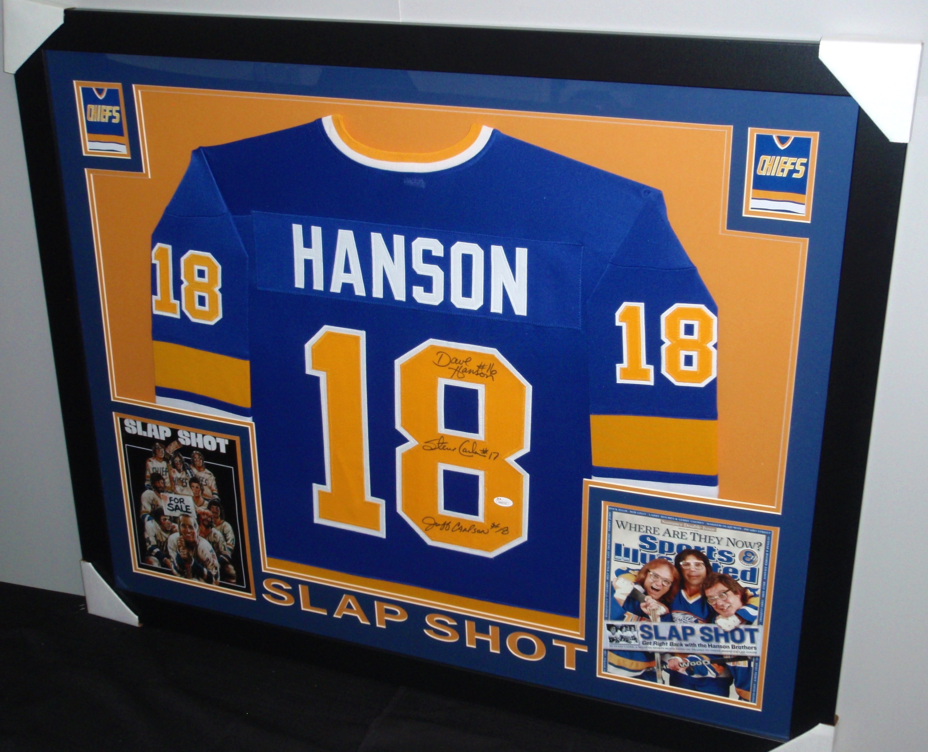 Hanson Brothers Signed "Slap Shot" Chiefs 35x43 Custom Framed Jersey Signed by (3) with Dave Hanson, Steve Carlson & Jeff Carlson (JSA COA) at PristineAuction.com Hanson Brothers Signed "Slap Shot" Chiefs 35x43 Custom Framed Jersey Signed by (3) with Dave Hanson, Steve Carlson & Jeff Carlson (JSA COA) at PristineAuction.com