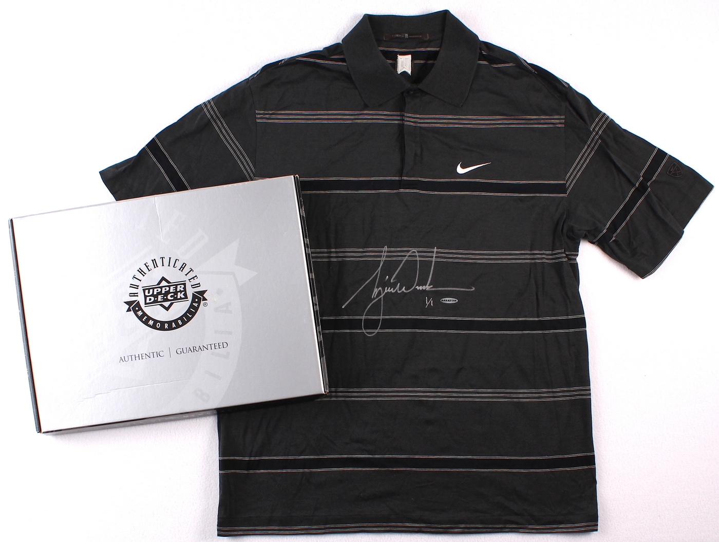 Tiger Woods Signed Tournament Worn Black Nike Golf Shirt #1/1 (UDA COA) at PristineAuction.com Tiger Woods Signed Tournament Worn Black Nike Golf Shirt #1/1 (UDA COA) at PristineAuction.com