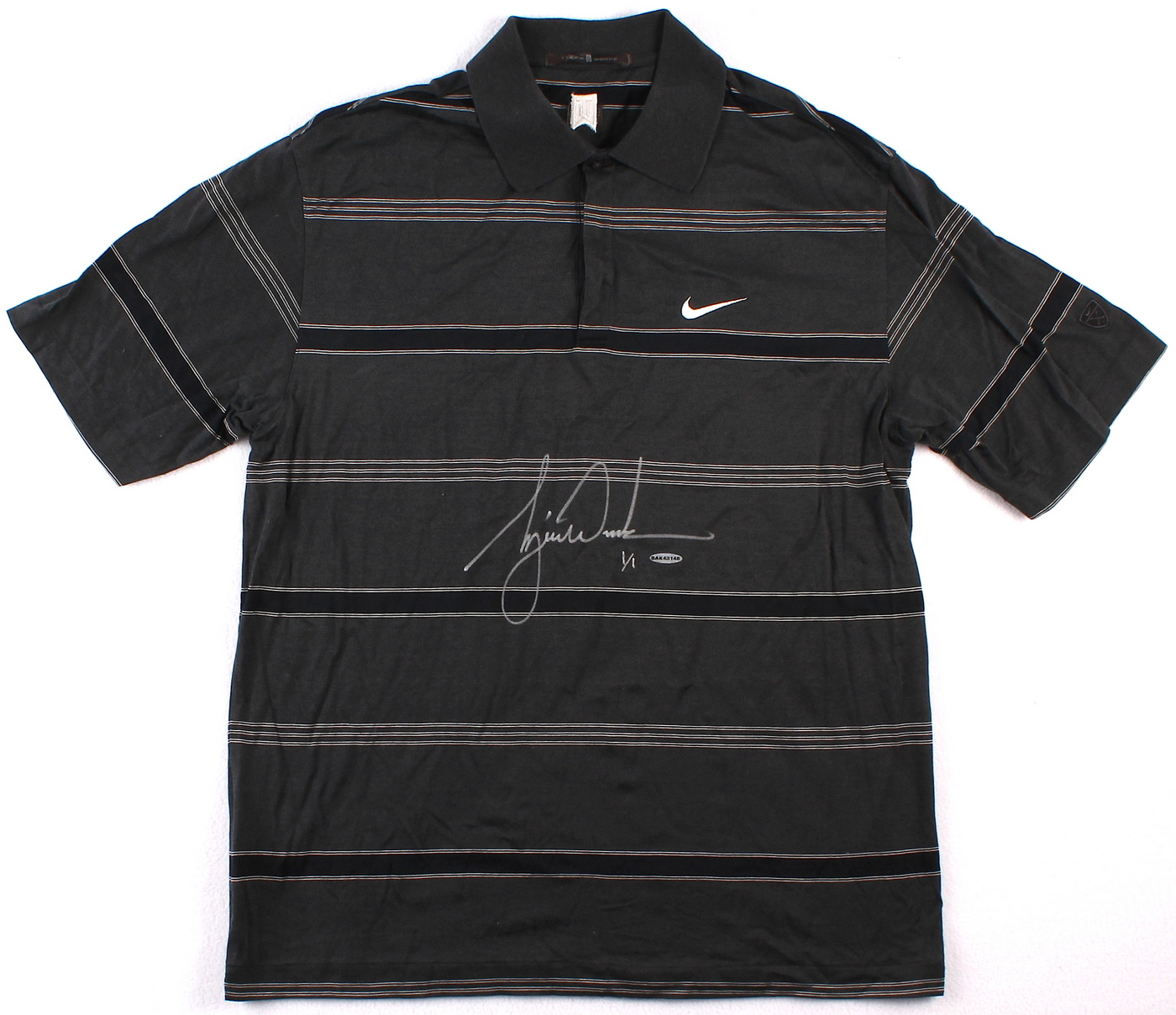 Tiger Woods Signed Tournament Worn Black Nike Golf Shirt #1/1 (UDA COA) at PristineAuction.com Tiger Woods Signed Tournament Worn Black Nike Golf Shirt #1/1 (UDA COA) at PristineAuction.com