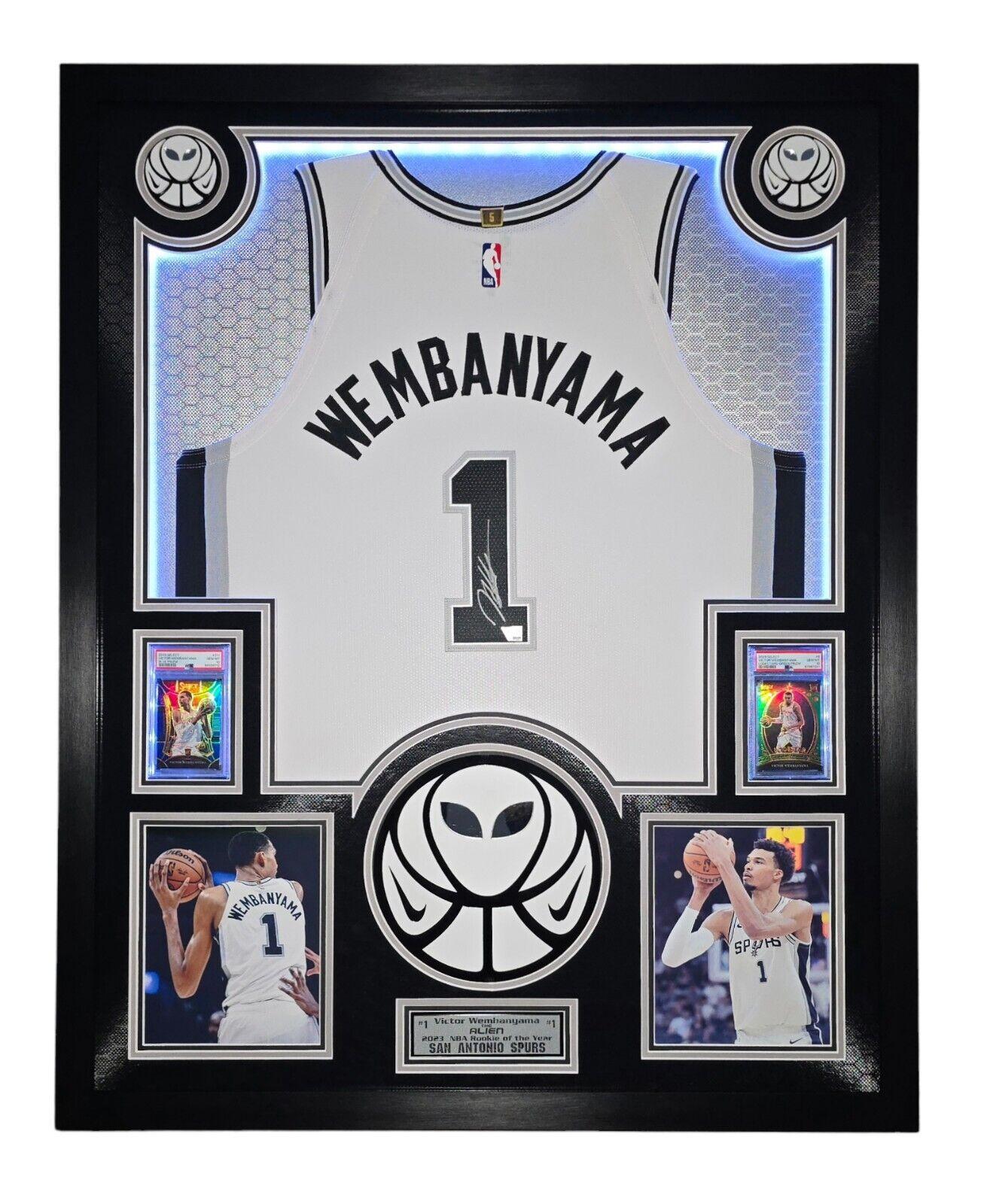 Victor Wembanyama Signed Spurs Custom Framed Nike Vaporknit Jersey with LED Display & (2) PSA 10 Graded Rookie Cards (Fanatics) at PristineAuction.com Victor Wembanyama Signed Spurs Custom Framed Nike Vaporknit Jersey with LED Display & (2) PSA 10 Graded Rookie Cards (Fanatics) at PristineAuction.com