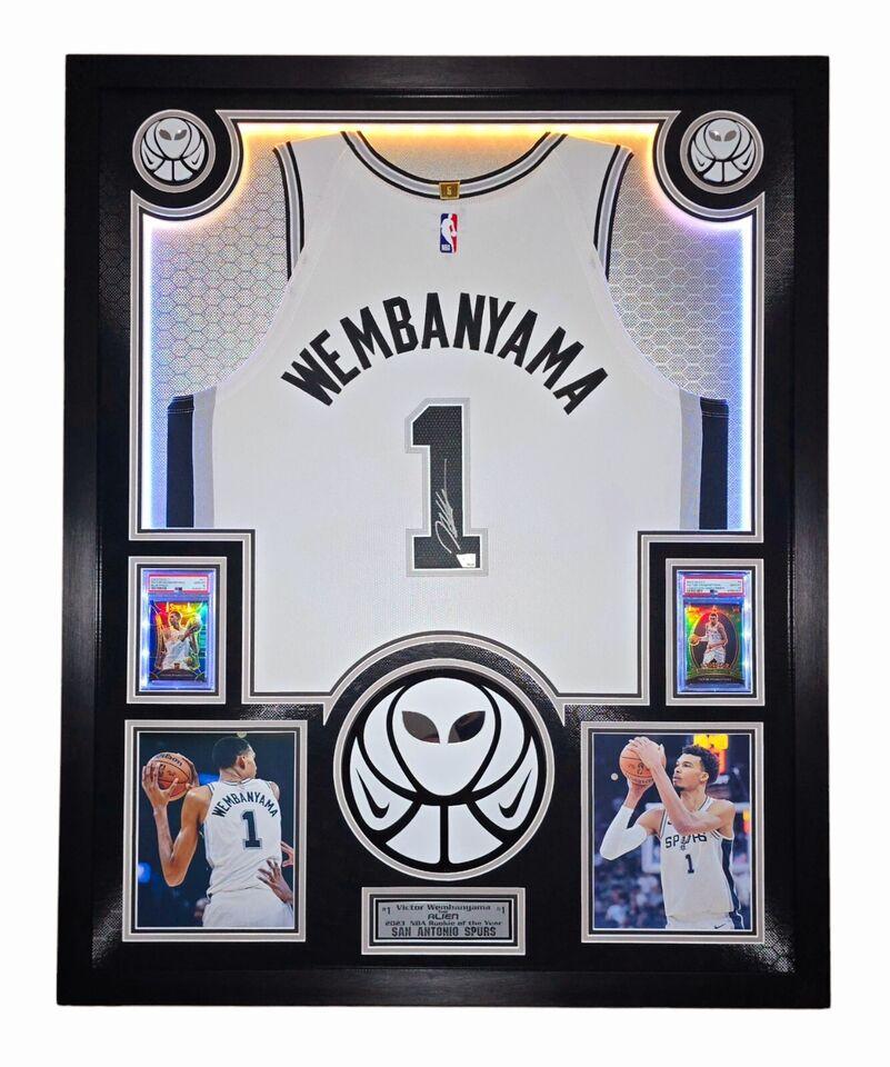 Victor Wembanyama Signed Spurs Custom Framed Nike Vaporknit Jersey with LED Display & (2) PSA 10 Graded Rookie Cards (Fanatics) at PristineAuction.com Victor Wembanyama Signed Spurs Custom Framed Nike Vaporknit Jersey with LED Display & (2) PSA 10 Graded Rookie Cards (Fanatics) at PristineAuction.com