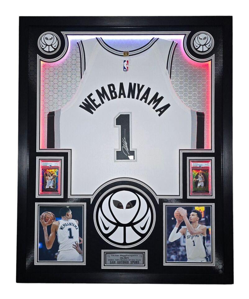 Victor Wembanyama Signed Spurs Custom Framed Nike Vaporknit Jersey with LED Display & (2) PSA 10 Graded Rookie Cards (Fanatics) at PristineAuction.com Victor Wembanyama Signed Spurs Custom Framed Nike Vaporknit Jersey with LED Display & (2) PSA 10 Graded Rookie Cards (Fanatics) at PristineAuction.com