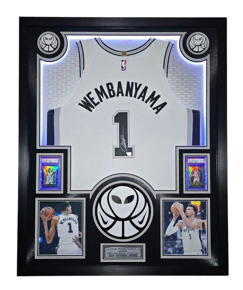 Victor Wembanyama Signed Spurs Custom Framed Nike Vaporknit Jersey with LED Display & (2) PSA 10 Graded Rookie Cards (Fanatics) at PristineAuction.com Victor Wembanyama Signed Spurs Custom Framed Nike Vaporknit Jersey with LED Display & (2) PSA 10 Graded Rookie Cards (Fanatics) at PristineAuction.com
