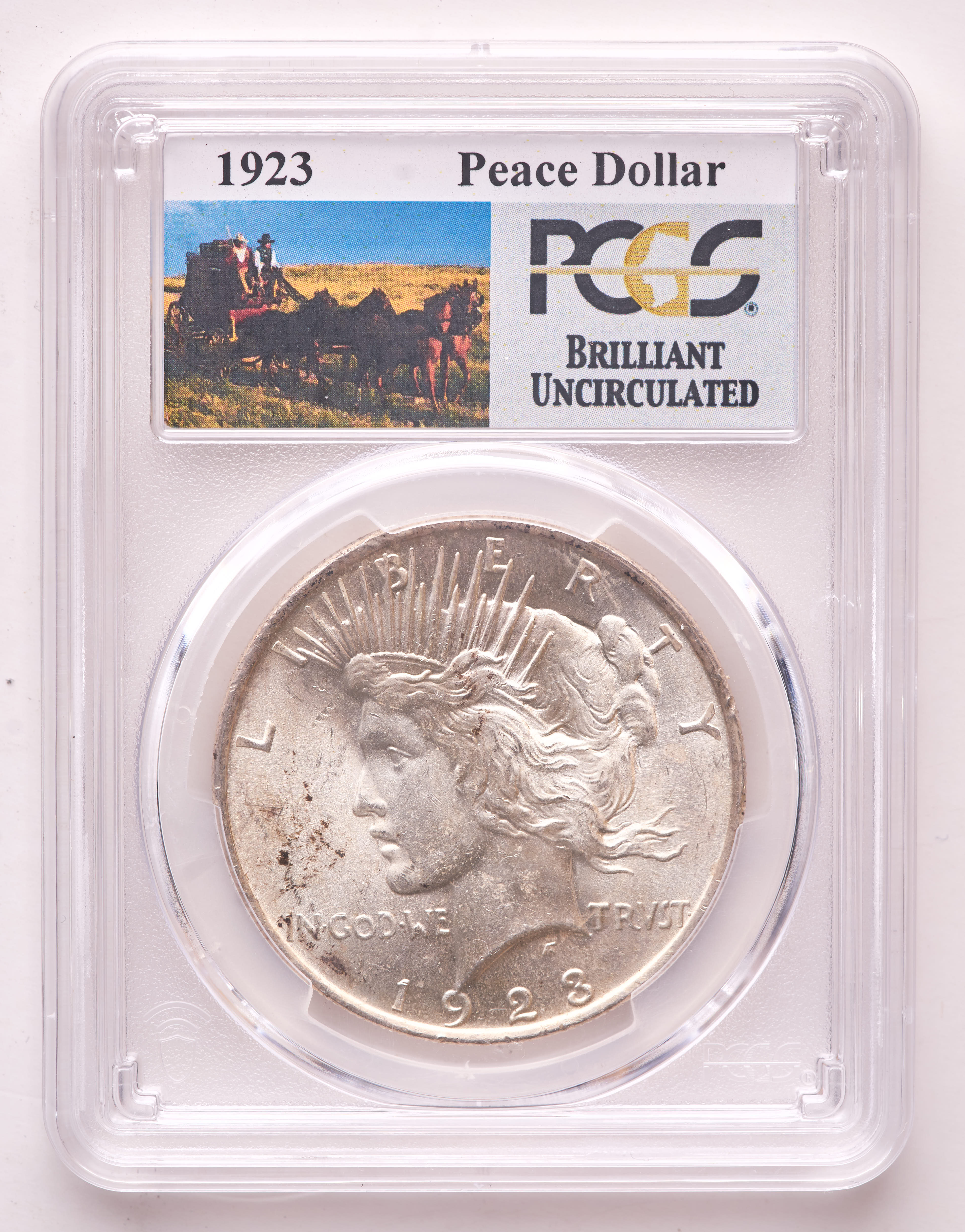 1923 Peace Silver Dollar - Stage Coach Label (PCGS Brilliant Uncirculated) at PristineAuction.com 1923 Peace Silver Dollar - Stage Coach Label (PCGS Brilliant Uncirculated) at PristineAuction.com