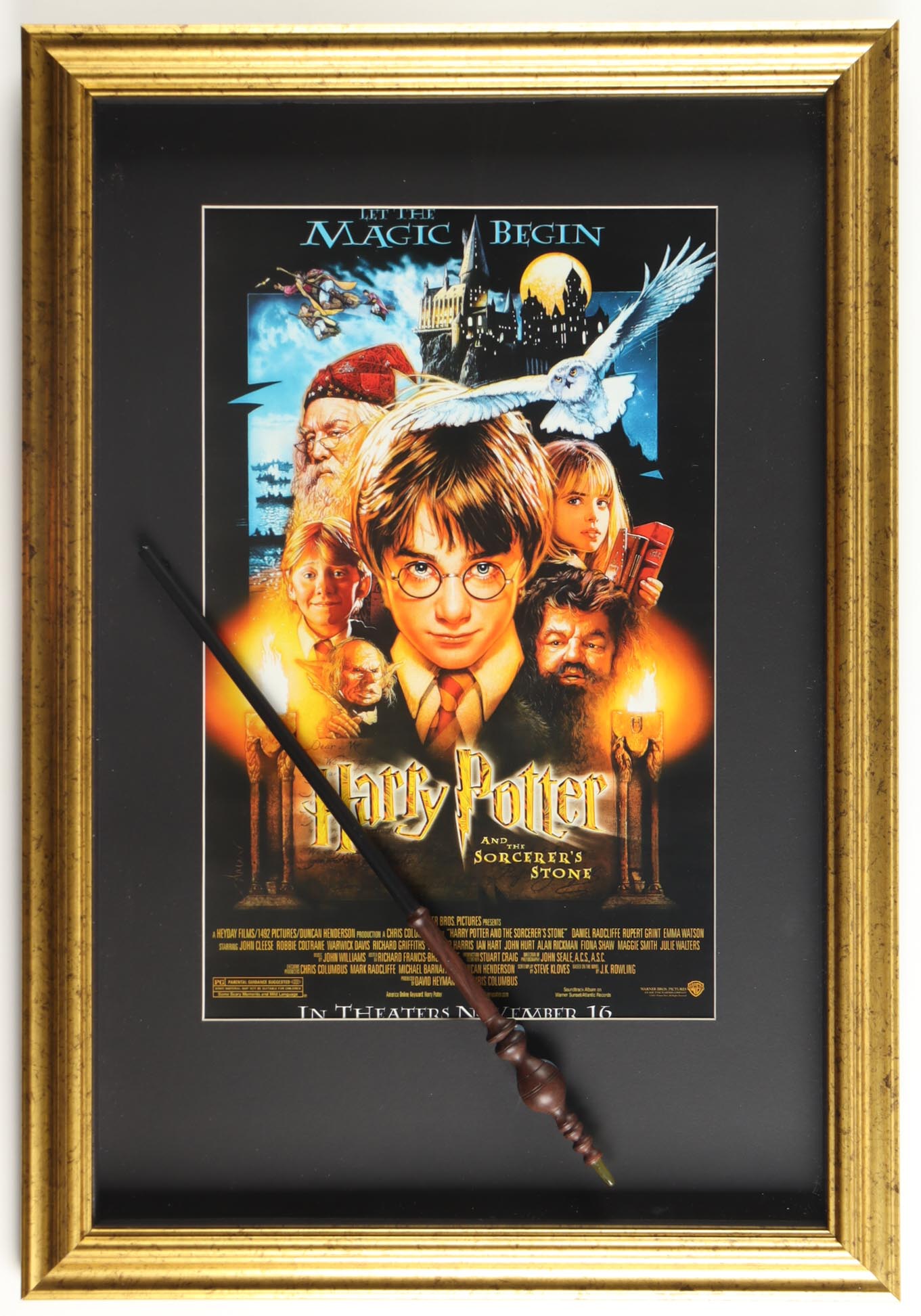 "Harry Potter And The Sorcerer's Stone" Custom Framed Movie Poster Print Display with Replica Prop Wand at PristineAuction.com "Harry Potter And The Sorcerer's Stone" Custom Framed Movie Poster Print Display with Replica Prop Wand at PristineAuction.com