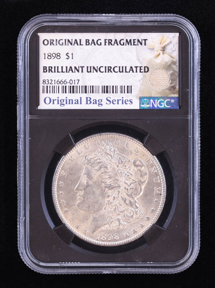 1898 Morgan Silver Dollar - Original Bag Fragment Relic (NGC BRILLIANT UNCIRCULATED) at PristineAuction.com 1898 Morgan Silver Dollar - Original Bag Fragment Relic (NGC BRILLIANT UNCIRCULATED) at PristineAuction.com