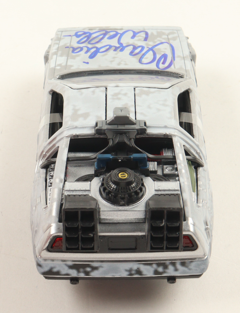 Claudia Wells Signed "Back to the Future" DeLorean Time Machine 1:32 Scale Die-Cast Car (Beckett) at PristineAuction.com Claudia Wells Signed "Back to the Future" DeLorean Time Machine 1:32 Scale Die-Cast Car (Beckett) at PristineAuction.com