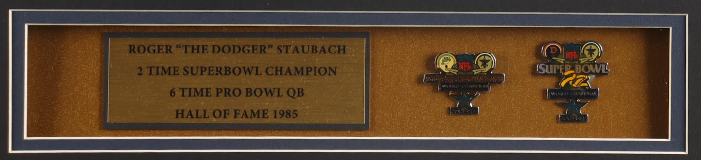 Roger Staubach Signed Custom Framed Jersey Display With (2) Official Super Bowl Pins & (2) Cloth Team Logo Patches (Beckett) at PristineAuction.com Roger Staubach Signed Custom Framed Jersey Display With (2) Official Super Bowl Pins & (2) Cloth Team Logo Patches (Beckett) at PristineAuction.com