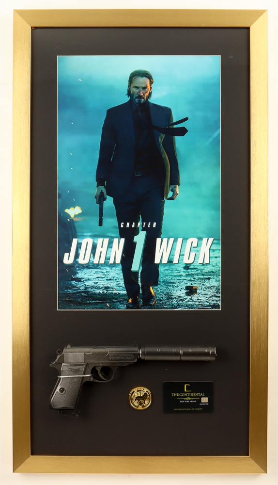 "John Wick Chapter 1" Custom Framed Movie Poster Display with Replica Prop Pistol, Replica Gold Coin & Continental Hotel Key Card at PristineAuction.com "John Wick Chapter 1" Custom Framed Movie Poster Display with Replica Prop Pistol, Replica Gold Coin & Continental Hotel Key Card at PristineAuction.com
