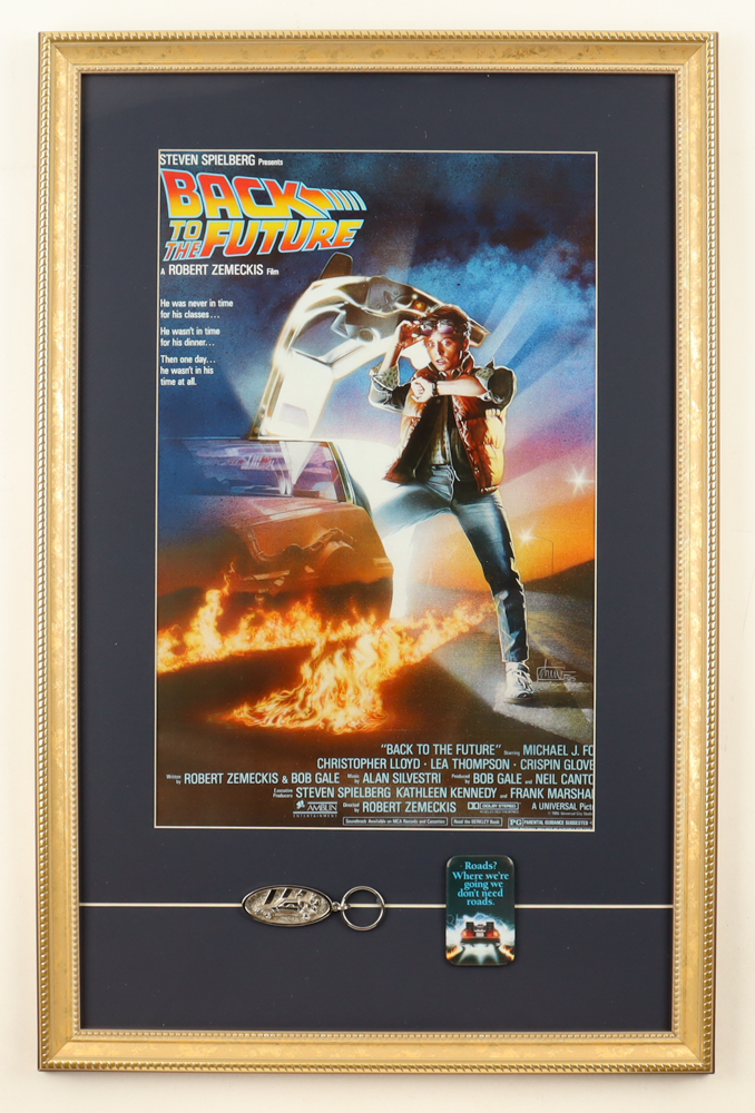 "Back to The Future " Custom Framed Poster Print Display with Souvenir DeLorean Keychain & Movie Pin at PristineAuction.com "Back to The Future " Custom Framed Poster Print Display with Souvenir DeLorean Keychain & Movie Pin at PristineAuction.com